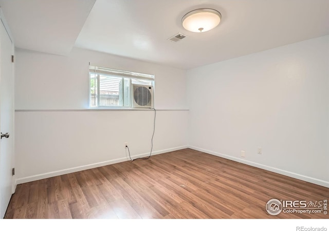 6864 Balsam St, Arvada, CO 80004 - spare room with wood finished floors and baseboards