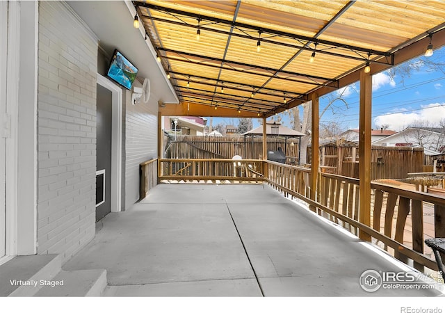 6864 Balsam St, Arvada, CO 80004 - view of patio featuring an outbuilding