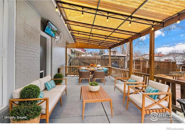 6864 Balsam St, Arvada, CO 80004 - view of patio with an outdoor living space and outdoor dining space