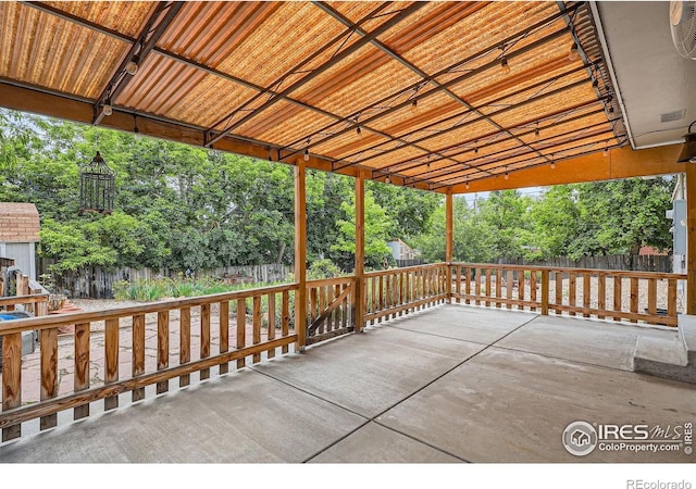 6864 Balsam St, Arvada, CO 80004 - view of patio / terrace featuring view of wooded area