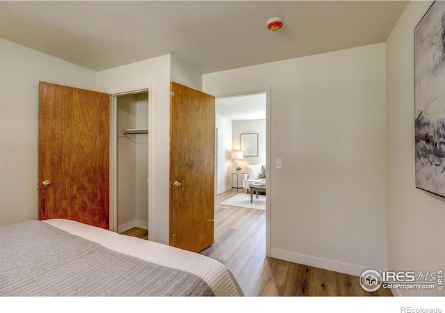 1343 E 7th St Unit 1, Loveland, CO 80537 - bedroom featuring wood finished floors and a closet
