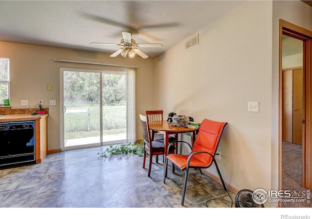 1343 E 7th St Unit 1, Loveland, CO 80537 - dining room featuring a ceiling fan and baseboards