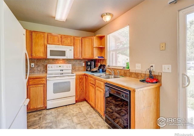 1343 E 7th St Unit 1, Loveland, CO 80537 - kitchen with white appliances, decorative backsplash, plenty of natural light, and light countertops