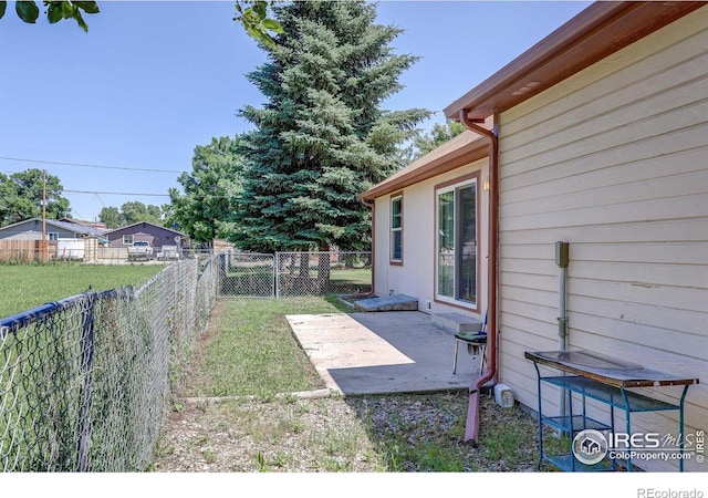 1343 E 7th St Unit 1, Loveland, CO 80537 - fenced backyard with a patio area