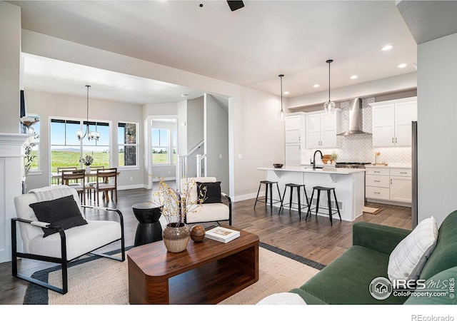 1550 Harebell St, Berthoud, CO 80513 - living room with wood finished floors, recessed lighting, and a chandelier