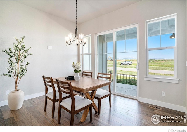 1550 Harebell St, Berthoud, CO 80513 - dining space with a chandelier and wood finished floors