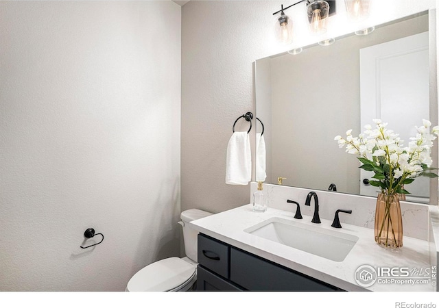 1550 Harebell St, Berthoud, CO 80513 - bathroom with vanity and a textured wall