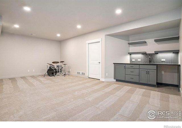 1550 Harebell St, Berthoud, CO 80513 - kitchen featuring open shelves, recessed lighting, light carpet, gray cabinets, and decorative backsplash