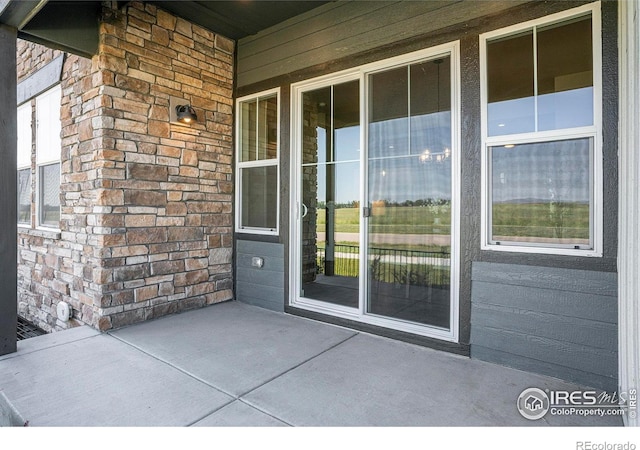 1550 Harebell St, Berthoud, CO 80513 - entrance to property with a porch and brick siding