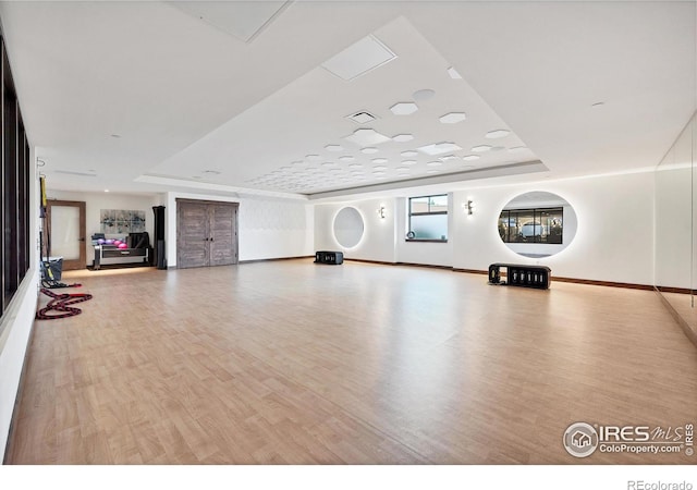 1550 Harebell St, Berthoud, CO 80513 - exercise area with wood finished floors and a raised ceiling