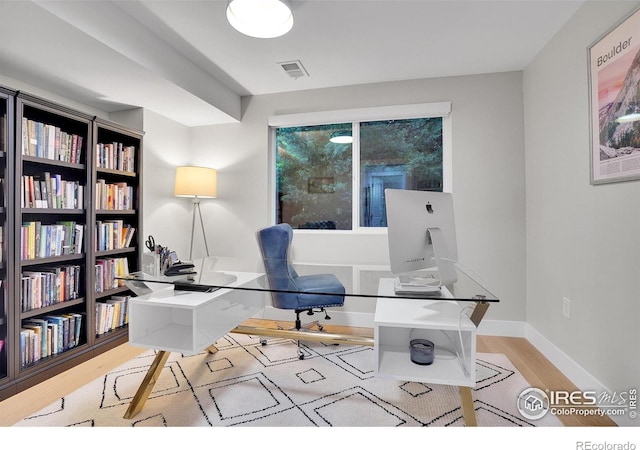 7146 Petursdale Ct, Boulder, CO 80301 - home office with wood finished floors and baseboards