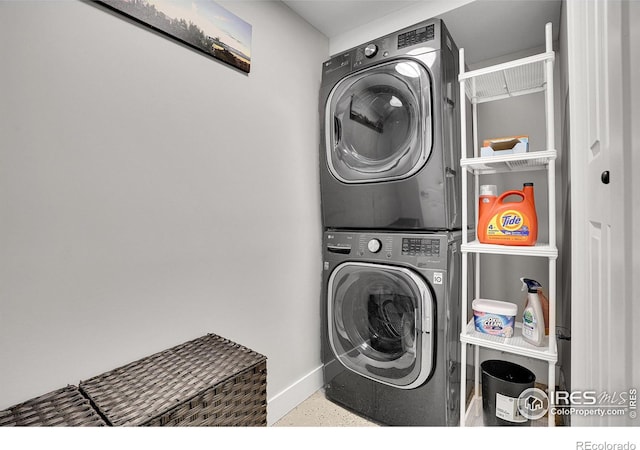 7146 Petursdale Ct, Boulder, CO 80301 - laundry room featuring stacked washer / drying machine and baseboards