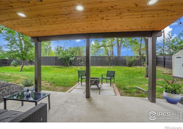 7146 Petursdale Ct, Boulder, CO 80301 - fenced backyard with a patio area, an outdoor fire pit, and a storage unit