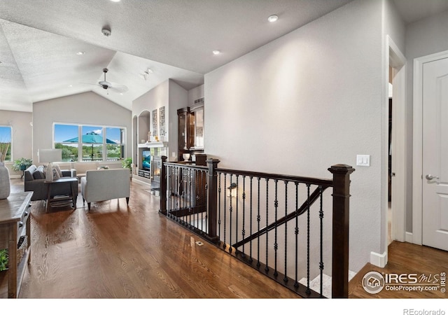 2055 Vineyard Dr, Windsor, CO 80550 - corridor with wood finished floors, an upstairs landing, and lofted ceiling