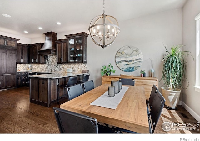 2055 Vineyard Dr, Windsor, CO 80550 - dining room with a chandelier, dark wood-style floors, and recessed lighting