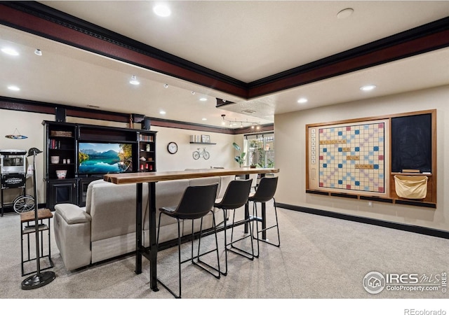 2055 Vineyard Dr, Windsor, CO 80550 - indoor wet bar with crown molding, recessed lighting, and light colored carpet