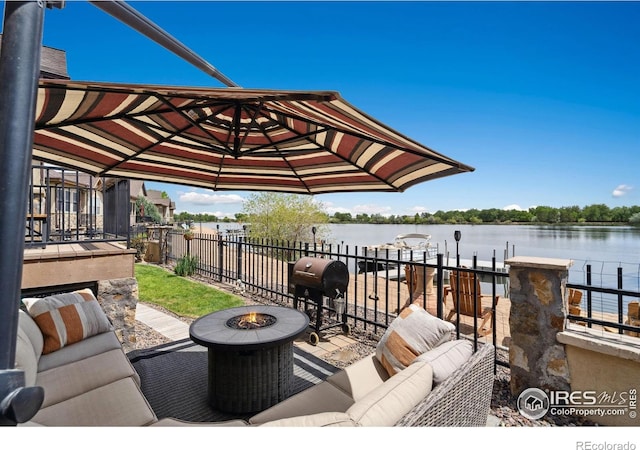 2055 Vineyard Dr, Windsor, CO 80550 - view of patio with area for grilling, a water view, an outdoor living space with a fire pit, and a dock