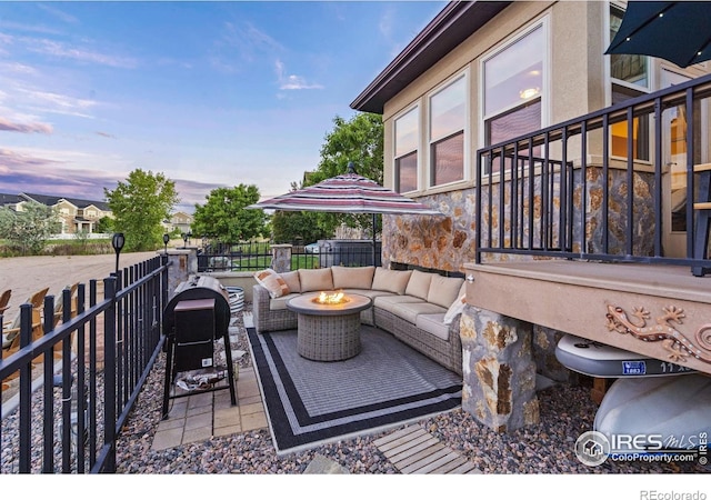 2055 Vineyard Dr, Windsor, CO 80550 - view of patio with an outdoor living space with a fire pit