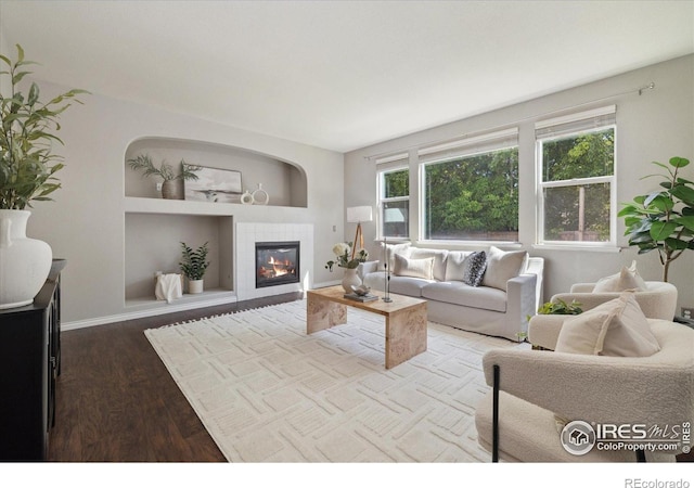 2133 Katahdin Dr, Fort Collins, CO 80525 - living room with wood finished floors and a tiled fireplace