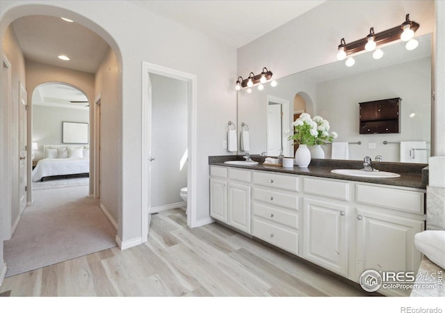 2133 Katahdin Dr, Fort Collins, CO 80525 - bathroom with wood finished floors, double vanity, and ensuite bathroom