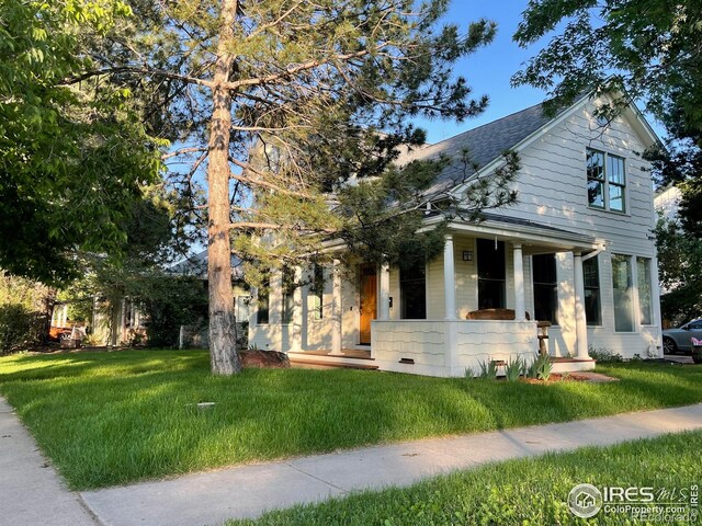 2204 Pine St, Boulder, CO 80302 - view of front of property with covered porch, a front lawn, and a shingled roof