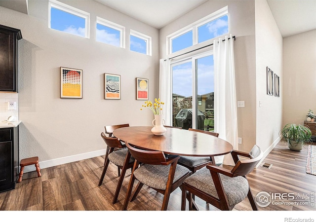 2716 San Cristobal Ct, Timnath, CO 80547 - dining room featuring dark wood-style flooring and baseboards