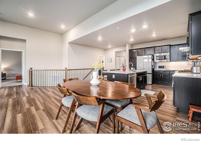 2716 San Cristobal Ct, Timnath, CO 80547 - dining area featuring wood finished floors and recessed lighting