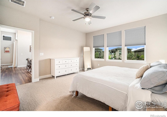 2716 San Cristobal Ct, Timnath, CO 80547 - carpeted bedroom featuring a ceiling fan and wood finished floors