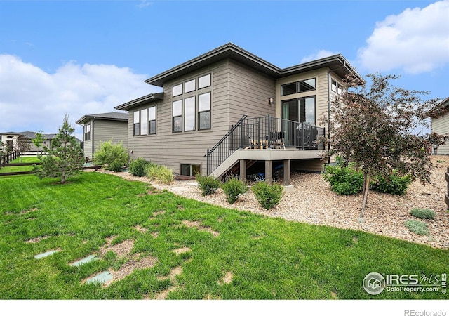 2716 San Cristobal Ct, Timnath, CO 80547 - back of property featuring a wooden deck, a lawn, and stairway