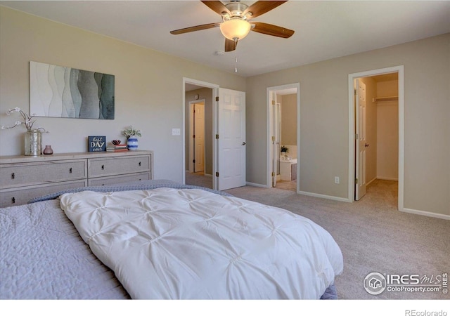 13382 Franklin St, Thornton, CO 80241 - bedroom featuring light carpet, a spacious closet, ensuite bathroom, and ceiling fan