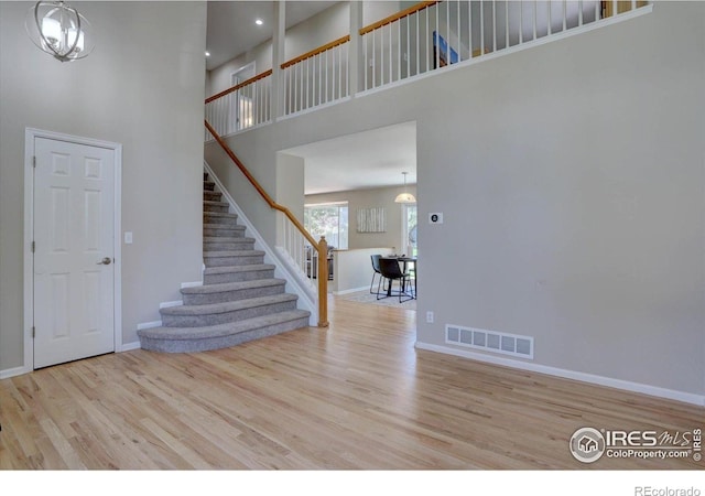 13382 Franklin St, Thornton, CO 80241 - entrance foyer with a towering ceiling, stairway, wood finished floors, and recessed lighting