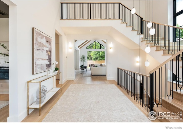 640 Iris Ave, Boulder, CO 80304 - foyer entrance with wood finished floors, stairway, and a towering ceiling