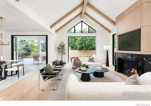 640 Iris Ave, Boulder, CO 80304 - living area with wood finished floors, a premium fireplace, and a chandelier