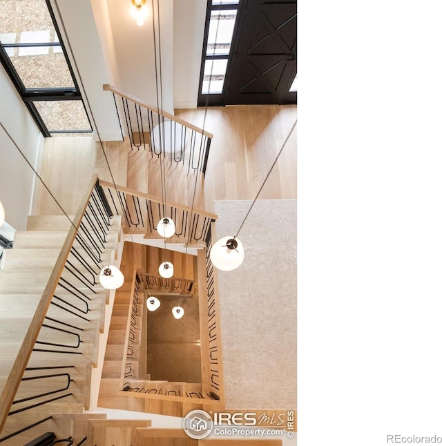 640 Iris Ave, Boulder, CO 80304 - stairway with healthy amount of natural light and wood finished floors