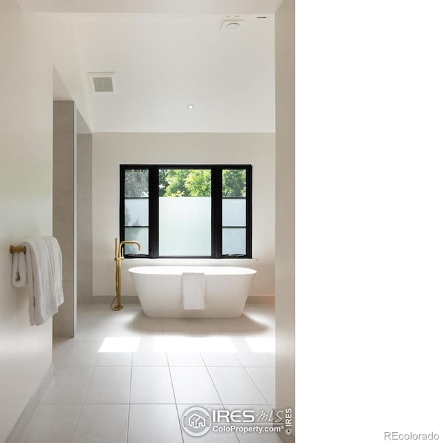640 Iris Ave, Boulder, CO 80304 - full bath featuring a soaking tub and tile patterned flooring