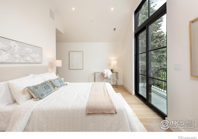 640 Iris Ave, Boulder, CO 80304 - bedroom with access to outside, wood finished floors, and lofted ceiling