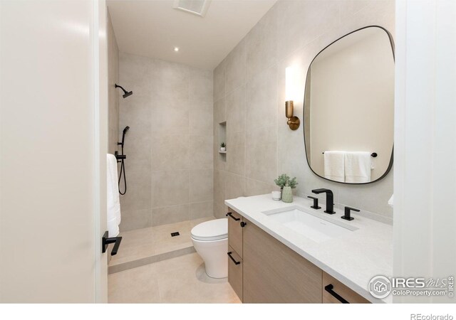640 Iris Ave, Boulder, CO 80304 - bathroom with vanity, a tile shower, and tile patterned floors