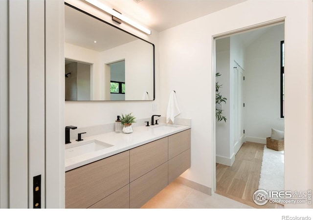 640 Iris Ave, Boulder, CO 80304 - full bathroom featuring double vanity and wood finished floors