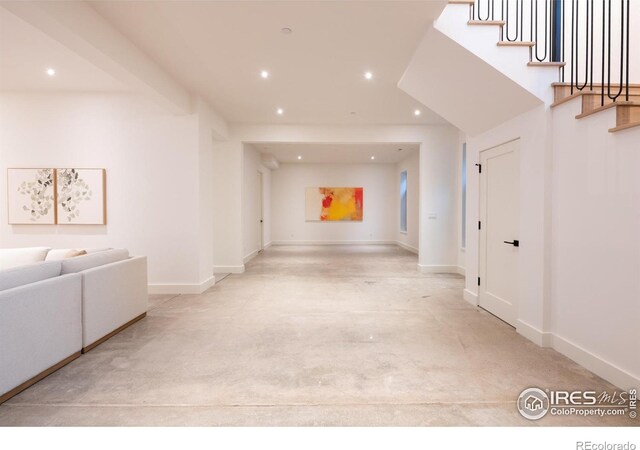 640 Iris Ave, Boulder, CO 80304 - unfurnished living room with recessed lighting, concrete floors, and stairway