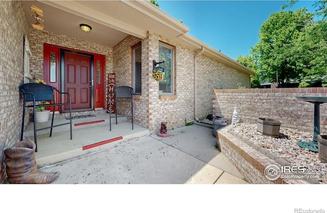 4557 W Pioneer Ln, Greeley, CO 80634 - entrance to property featuring brick siding