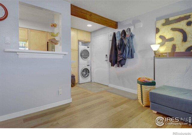 2636 Juniper Ave Unit 1, Boulder, CO 80304 - foyer with estacked washer and dryer, light wood-type flooring, beamed ceiling, and recessed lighting