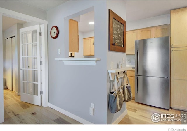 2636 Juniper Ave Unit 1, Boulder, CO 80304 - kitchen with freestanding refrigerator, light wood-style flooring, light brown cabinets, light countertops, and recessed lighting