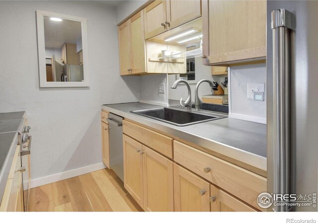 2636 Juniper Ave Unit 1, Boulder, CO 80304 - kitchen with light brown cabinets, stainless steel appliances, and light wood finished floors