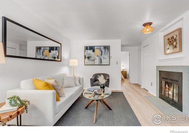 910 Portland Pl Unit 7, Boulder, CO 80304 - living room with wood finished floors and a tile fireplace