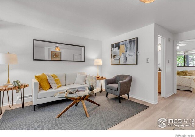 910 Portland Pl Unit 7, Boulder, CO 80304 - living area featuring light wood finished floors and baseboard heating