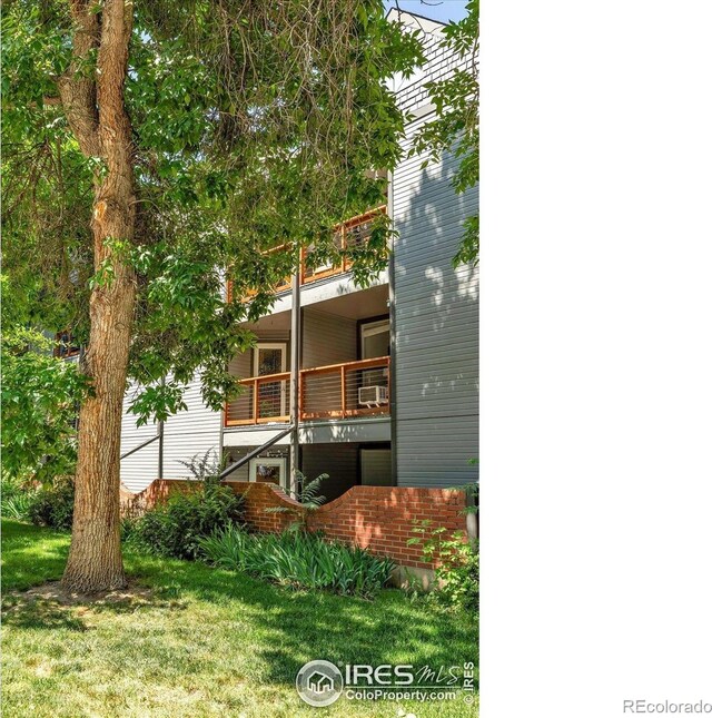 910 Portland Pl Unit 7, Boulder, CO 80304 - back of house featuring a lawn, a balcony, and cooling unit