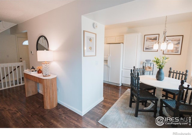 3025 Regatta Ln Unit 3, Fort Collins, CO 80525 - dining space featuring dark wood finished floors and a chandelier