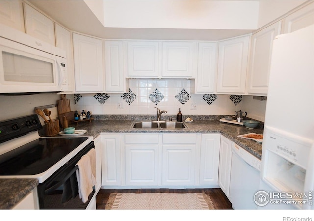 3025 Regatta Ln Unit 3, Fort Collins, CO 80525 - kitchen with white appliances, dark countertops, and white cabinets