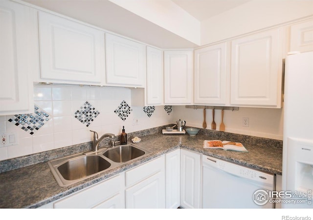 3025 Regatta Ln Unit 3, Fort Collins, CO 80525 - kitchen with white appliances, white cabinets, decorative backsplash, and dark countertops
