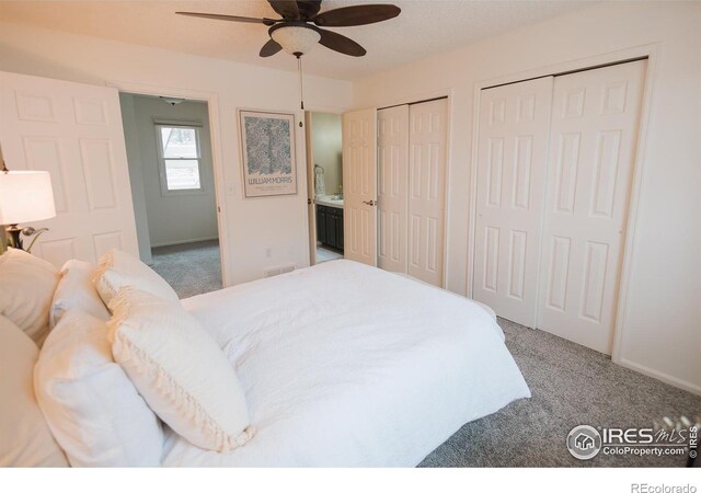 3025 Regatta Ln Unit 3, Fort Collins, CO 80525 - carpeted bedroom featuring multiple closets and a ceiling fan
